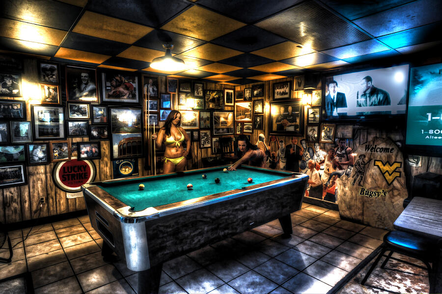 Playing pool in bar by Dan Friend