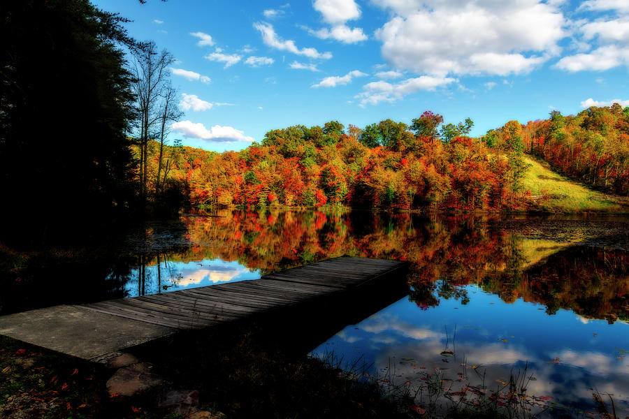 Dock at lake in the Fall by Dan Friend