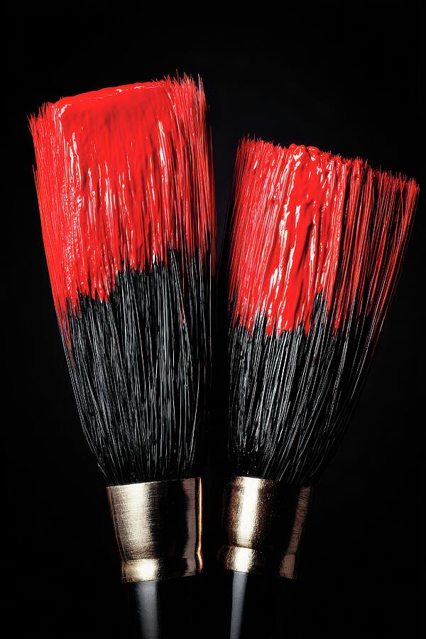 Red Paint Brushes On Black Background by Matthias Hauser